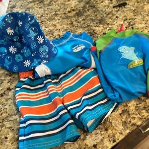 Boys 12 month swim lot. Shorts, shirt, one piece, and hat.